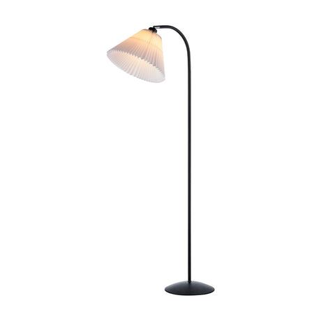 Medina Floor Lamp in white and black, featuring a pleated conical fabric shade on a curved black tube stem with round base, shown on a plain white background.