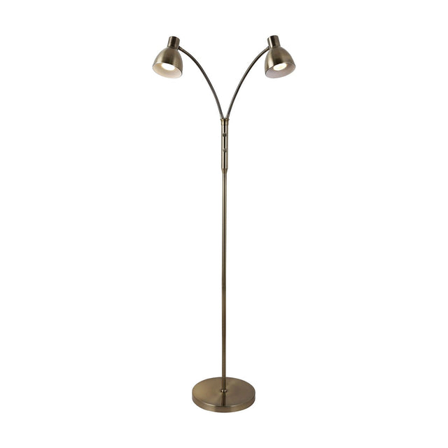 Hudson 2-light floor lamp in antique brass, slim stem on a round disc base, splitting into two curved arms with small cone shades, shown on a plain white background.
