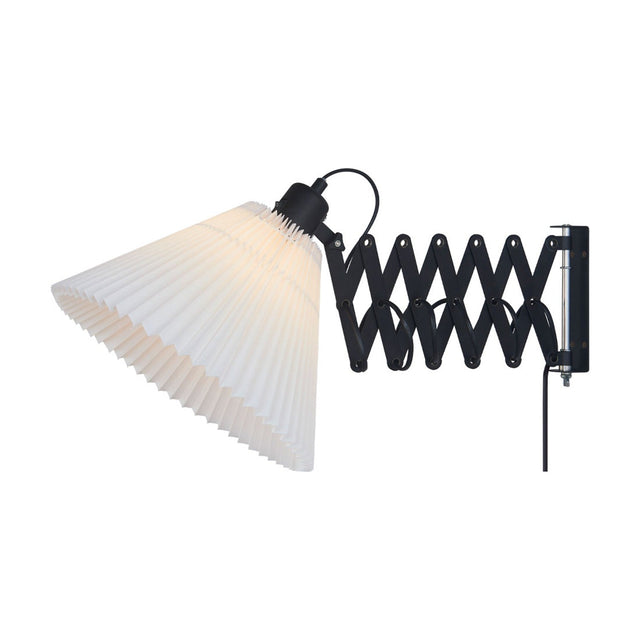 Medina X Wall Light with a white pleated conical fabric shade on a black scissor arm mechanism with metal lattice slats and rivets, shown on a plain white background.