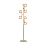 Atom 6 Light Floor Lamp in antique brass, with six amber glass globes branching at angles up a slim vertical rod on a round base, shown on a plain white background.