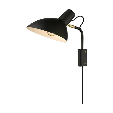 Metropole Wall Light in matte black with a dome shade on a curved arm, brass pivot joint, and rectangular wall plate, shown on a plain white background.
