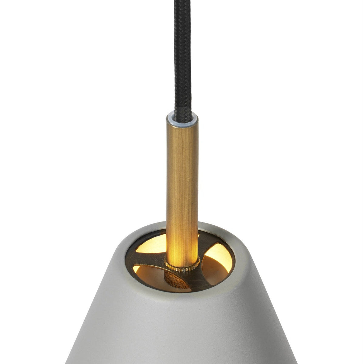 Close-up of the Hygge Pendant Light 12cm in warm grey, showing the metal cone shade's cream-lined interior and polished brass tube connecting to a black flex cord.