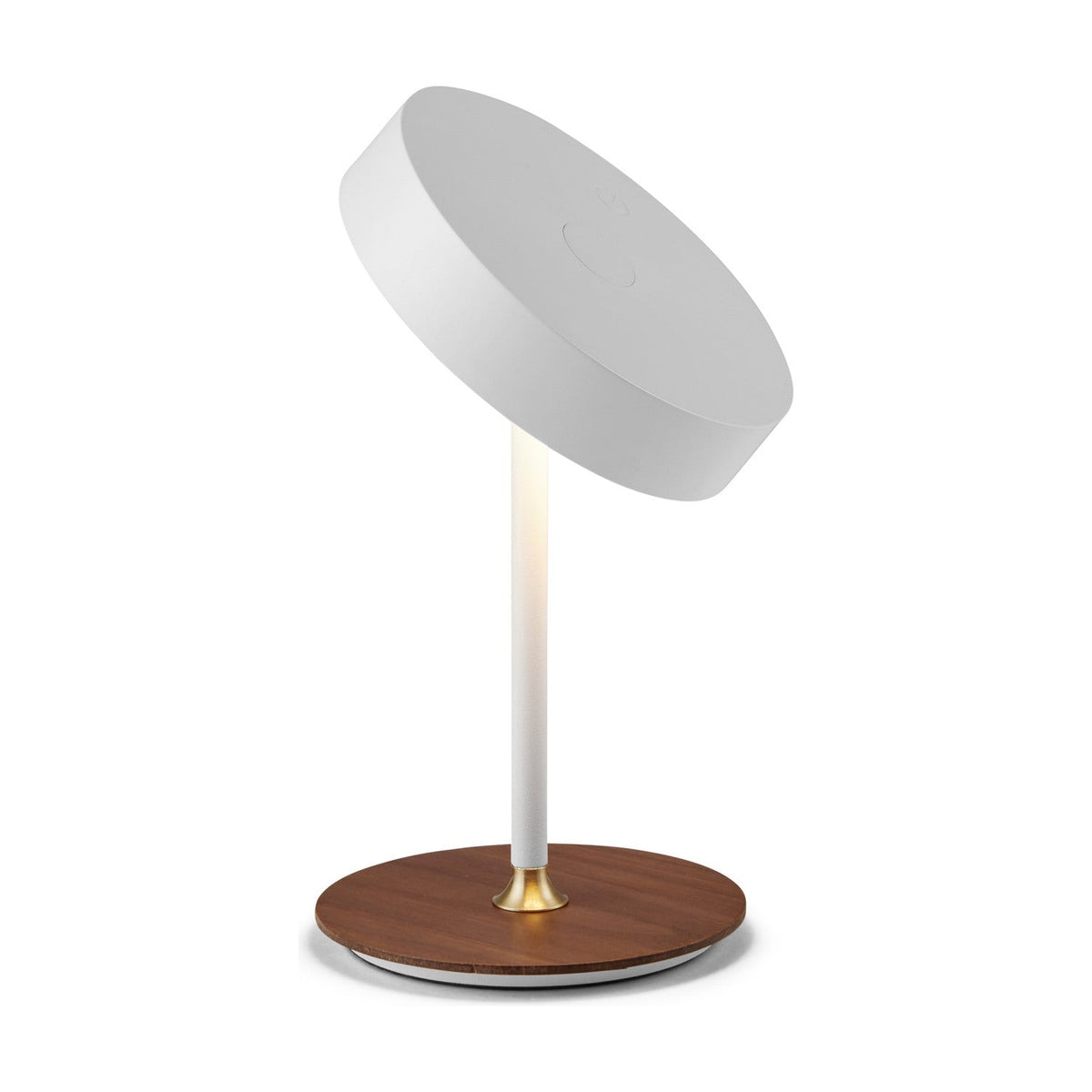 On the Move LED rechargeable table lamp with tilted white drum shade on a slim glowing stem, round walnut base, brass collar detail, plain white background.