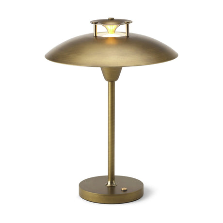Stepp LED Outdoor Table Lamp in antique brass with a wide shallow saucer shade, stepped cap emitting a glowing ring, slim stem, and round base with control button, on a plain white background.