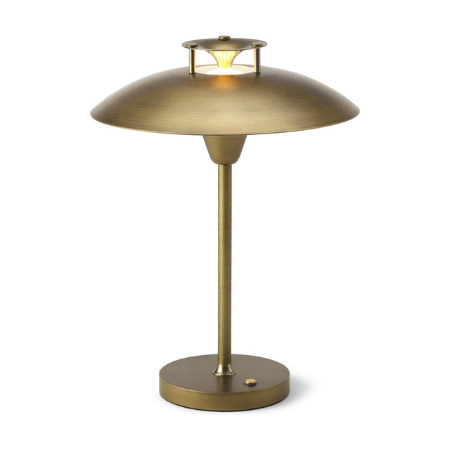 Stepp LED Outdoor Table Lamp in antique brass with a wide shallow saucer shade, stepped cap emitting a glowing ring, slim stem, and round base with control button, on a plain white background.