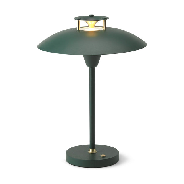 Stepp LED Outdoor Table Lamp in dark green, with a wide flared disc shade, brass accents, slim stem, and round base with power button, on a white background.