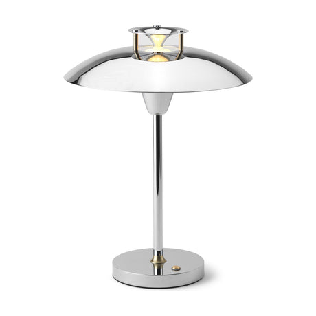 Stepp LED Outdoor Table Lamp in chrome, with a wide flat disc shade, stepped cap emitting a bright light ring, slim stem, and round base with brass collar on a white background.