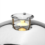 Close-up of the Stepp LED Outdoor Table Lamp in chrome, showing the shallow flared disc, stepped cap on posts, and warm LED glow, against a plain white background.
