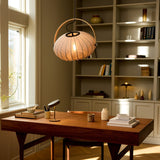 DC Textile Stone Pendant Light 40cm in grey, ribbed fabric shade with arched brass handle, hanging above a wooden desk in a home office setting.