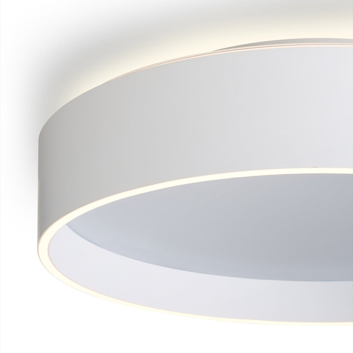 Close-up of the Universal LED 3 Light Flush Ceiling Light 42cm in white, showing its round drum shape with a recessed diffuser and glowing edge detail against a plain background.