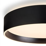 Close-up of the Universal LED 3 Light Flush Ceiling Light in black, showing the round drum's brushed metal edge and recessed white diffuser glowing warm white against a plain background.