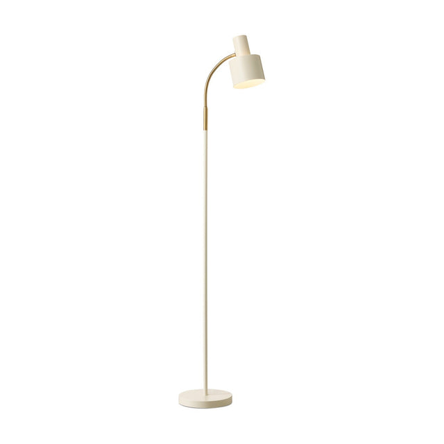 Vogue Floor Lamp in cream with a slim curved brass stem, angled cylindrical shade, and round flat base, shown on a plain white background.