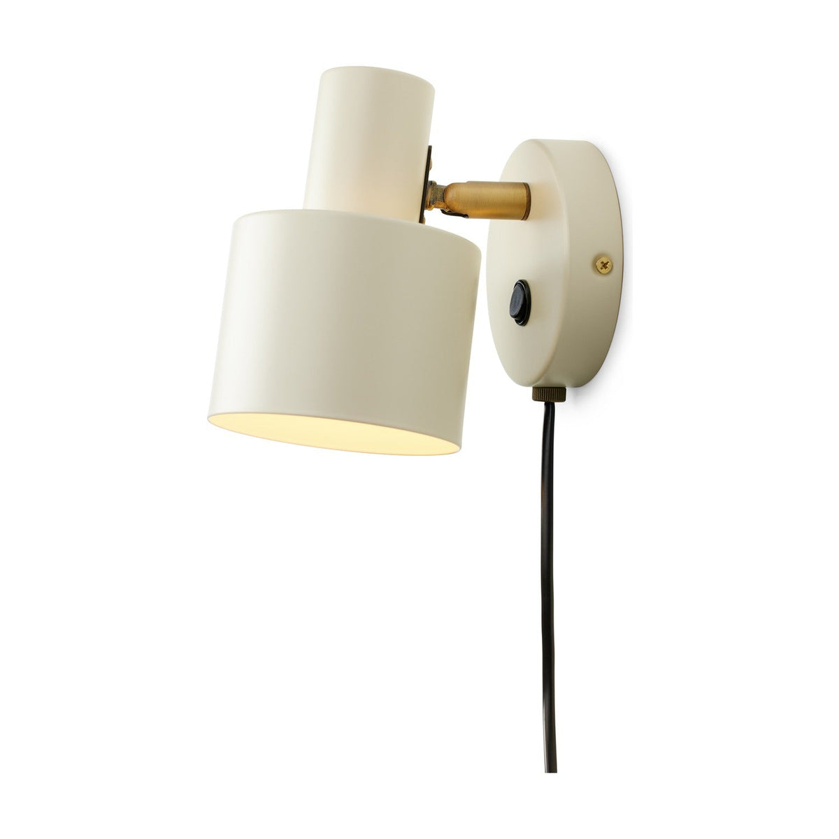 Vogue Wall Light in cream, with a cylindrical cream shade tilted downward on a brass knuckle joint, mounted on a round cream wall plate with a small switch, shown on a plain white background.