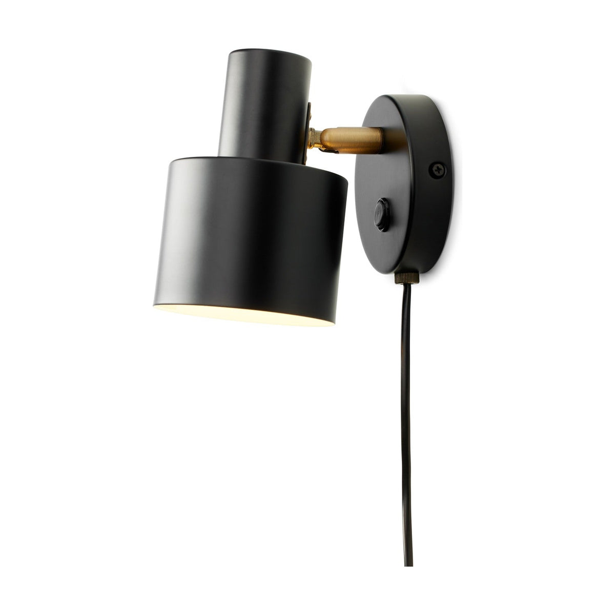 Vogue Wall Light in black with a cylindrical shade angled downward on a brass knuckle joint from a round wall plate, featuring a visible switch and cable, shown against a plain white background.