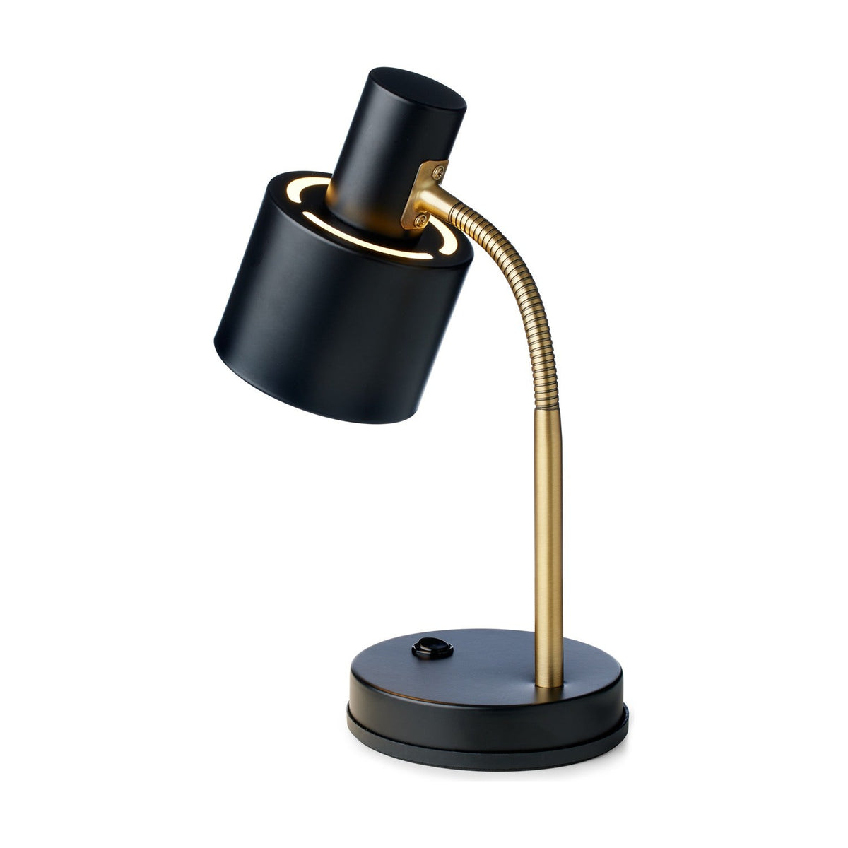 Vogue Table Lamp in black with a cylindrical shade on a brass gooseneck arm, round black base with switch, on a plain white background.