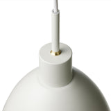 Close-up of the Rock Pendant Light 20cm in white, showing the domed shade's smooth curve, brass detailing at the cord entry, and matt finish against a plain white background.