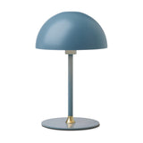 Boogie Table Lamp 16cm in petrol blue, featuring a matte dome shade on a slim stem with round base and small brass accent, shown on a plain white background.