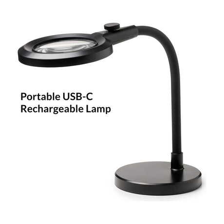Magni Portable Superflex Charge Table Lamp in black, with a round magnifying LED head, adjustable flexible arm, and circular base, shown on a white background.