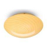 Candy Flush Ceiling Light 30cm in cream – wide, shallow opal glass dome with a swirling twisted-flute pattern and brass fixing screw, shown against a plain white background.