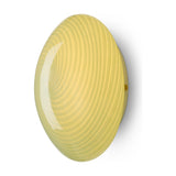 Candy Flush Ceiling Light 30cm in olive green glass, a shallow dome with swirling ribbed texture and off-centre spiral pattern, shown at an angle against a plain white background.