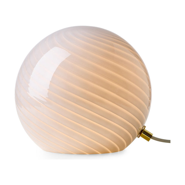Candy Table Lamp 20cm in grey, a spherical glass table lamp with fine spiral fluting and a small brass collar, glowing softly against a plain white background.