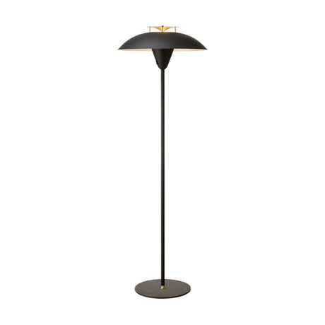 Stepp Floor Lamp in black with a wide shallow dome shade, antique brass fin detail at centre, slim stem and round base, shown on a plain white background.