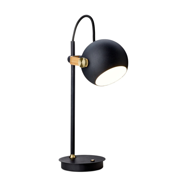 DC LED Go rechargeable table lamp with a black spherical head on an oak and brass swivel joint, arched black flex, slim post and round base, on a white background.