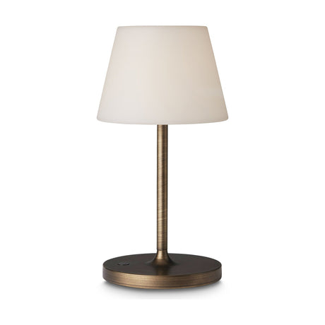 New Northern LED outdoor table lamp with a tall opal cone shade on a slim antique brass stem and round base, set against a plain white background.