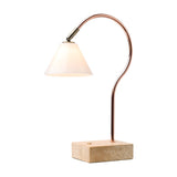 Question LED table lamp with a conical opal glass shade on an antique brass knuckle, curved copper rod, and travertine stone base, shown on a plain white background.