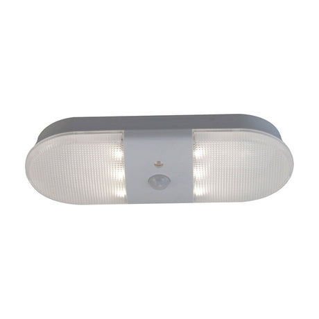 Push LED rechargeable table lamp in white, oval fitting with two prismatic grid panels, grey centre strip and sensor dome, shown on a plain white background.