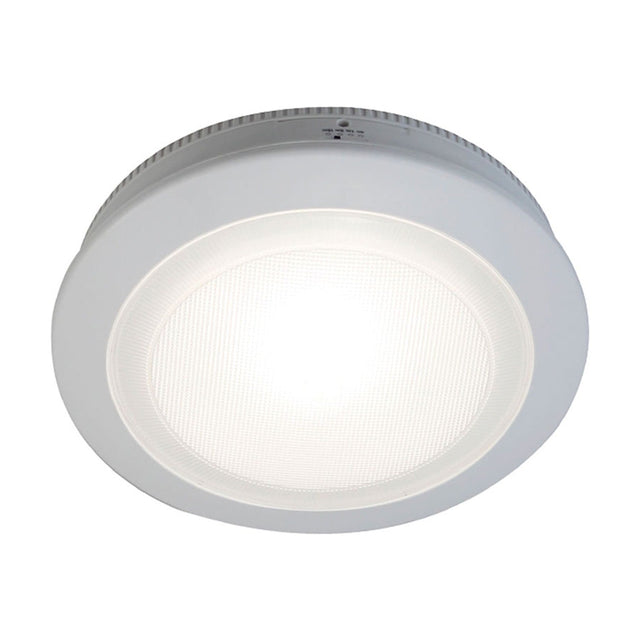 Push LED Maxi Rechargeable Table Lamp in white, a round puck-shaped design with a ribbed edge and gridded lens glowing at its centre, shown on a plain white background.