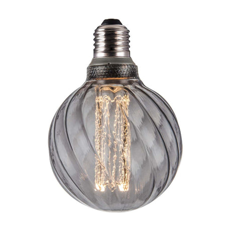 Colors Twist 5W 3-Step Memory Bulb, E27 fitting, round smoke glass globe with spiral fluted ribs and visible straight filament, dark textured collar, on a plain white background.
