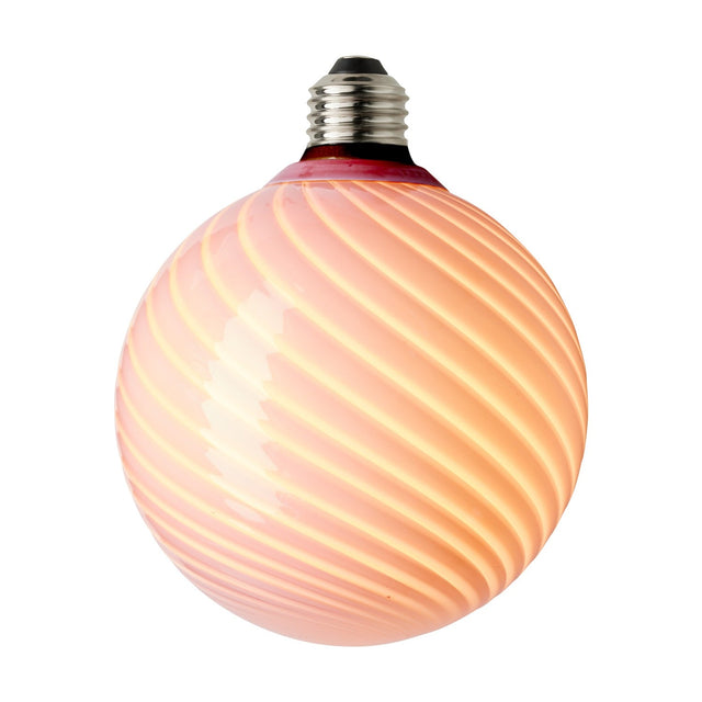 Colors Candy Bulb 12.5cm in Rose, a round LED bulb with twisted flute ribs in soft blush pink glass, silver E27 cap, on a plain white background.
