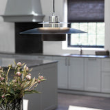Sørup Pendant Light 40cm in black and chrome, tiered disc shade with chrome rings, hanging above a kitchen island in a light grey kitchen setting.