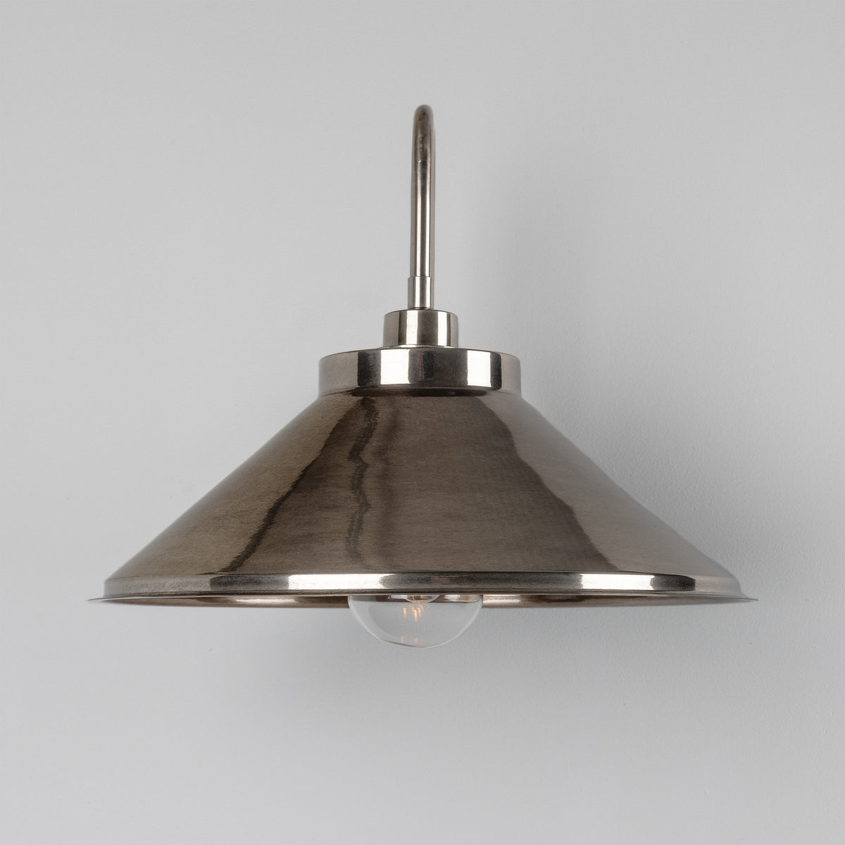 Halvery Brass Swan Neck Wall Light IP65 with curved arm, wide cone shade and exposed bulb, shown against a plain light grey background.