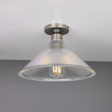 Hanoi Ribbed Glass Flush Ceiling Light with a cone-shaped prismatic glass shade and silver ceiling plate, shown lit against a plain grey background.