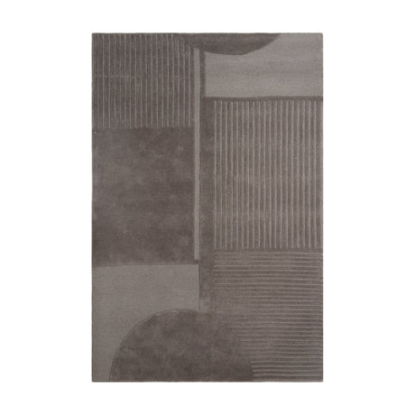 Haraan Rug 230 x 160cm in brown wool, featuring carved geometric panels with smooth blocks, ribbed stripe sections, and curved arcs, shown on a plain white background.