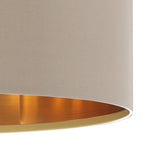 Close-up of the Hasanne fabric pendant light's drum shade in taupe with a brushed gold-toned interior lining, shown on a plain white background.