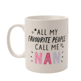 White porcelain mug with black handwritten text "All My Favourite People Call Me Nan," NAN in pink and lilac capitals with star and heart details, on a white background.