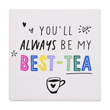 Square white stoneware coaster printed with "You'll always be my best-tea" in black and multicoloured capitals, with small hearts, starbursts, and a teacup design on a plain background.