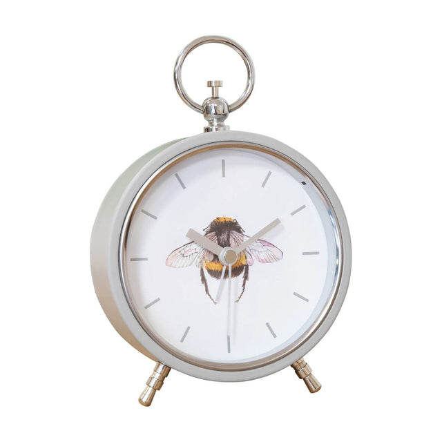 Round Bee Alarm Mantel Clock with grey metal case, white dial, bumblebee illustration, baton markers, top ring handle and angled feet, on a plain white background.
