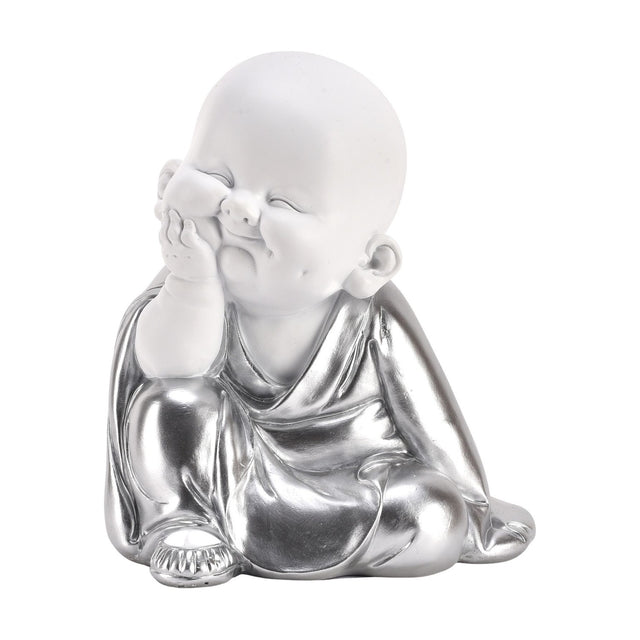 Buddha cherub figurine with chin resting on hand, seated smiling pose in white and silver finish, robe draped over crossed legs, on a plain white background.