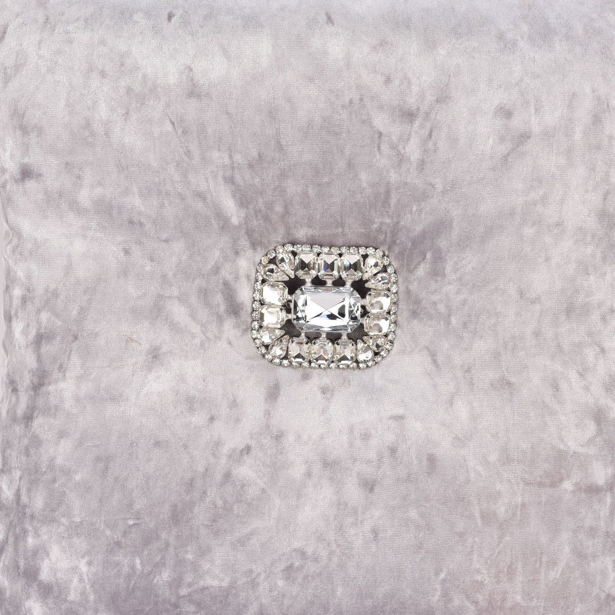Square crushed velvet cushion in silver, 35cm, with a central rectangular diamante embellishment, shown on a light grey textured background.
