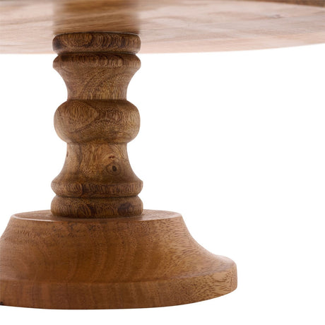 Close-up of a round wooden cake stand's turned pedestal base, showing natural brown wood grain and a flared foot, against a white background.