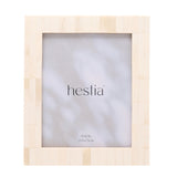 Wide border bone photo frame in white with brown edges, rectangular tiled design and glazed 8x10in opening, shown on a plain white background.