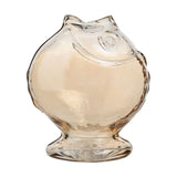 Round glass fish vase with footed base, clear glass with pale amber tint, moulded eye and fin details, open mouth forming the neck, on a plain white background.