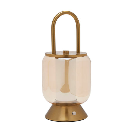 Lantern-style LED table lamp with a gold loop handle, gold lid and flared gold base framing a rounded amber glass shade, shown on a plain white background.