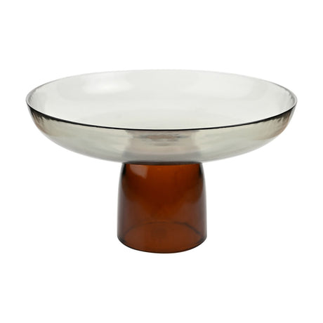 Large round raised glass bowl with a wide shallow smoke-grey dish on a short amber-brown stem, shown against a plain white background.