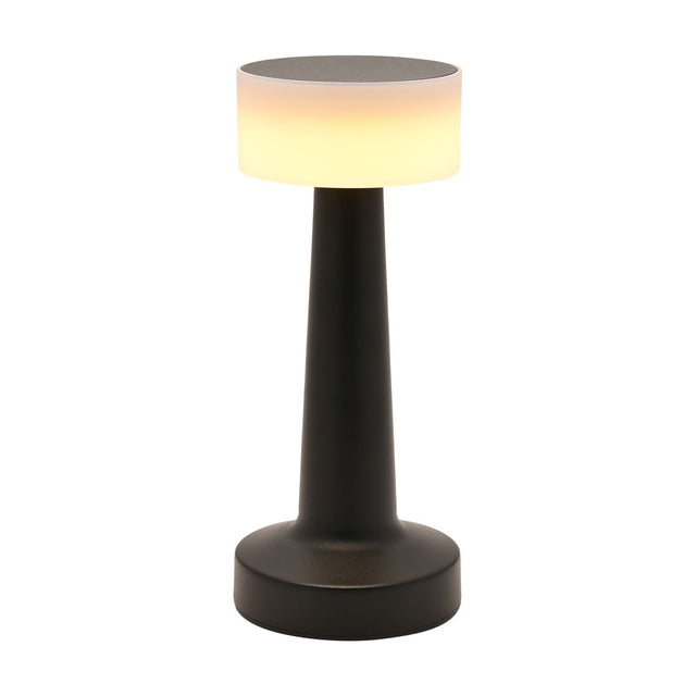 Matt black touch table lamp with a round drum shade on a tapered stem and wide round foot, LED lit and USB powered, shown switched on against a plain white background.