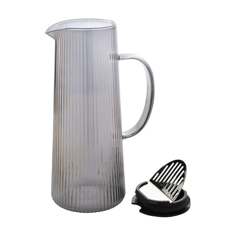 Tall tapered ribbed glass jug in grey with curved handle, pouring lip and vertical ribbing, 1300ml capacity, shown with lid on plain white background.